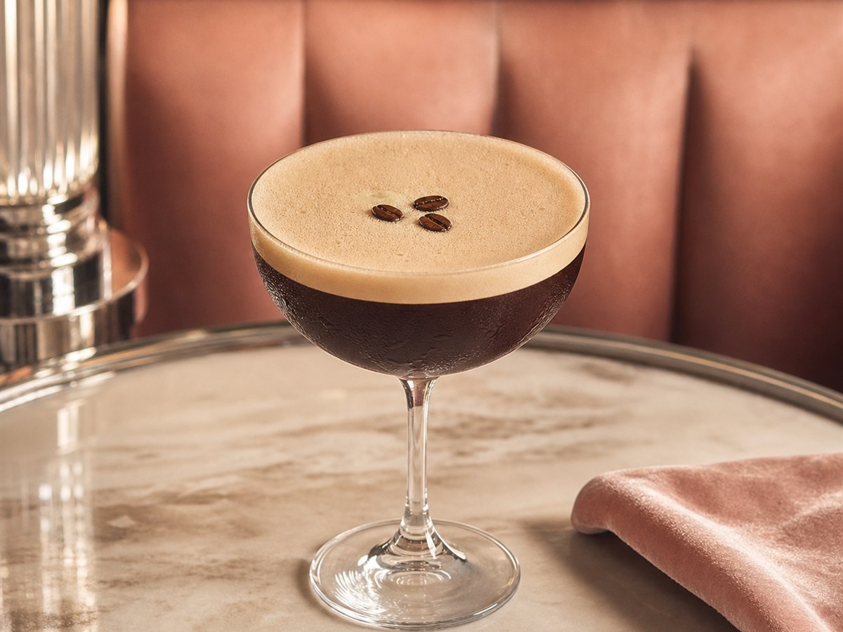 Espresso Martini cocktail served in a chilled coupe with three coffee beans