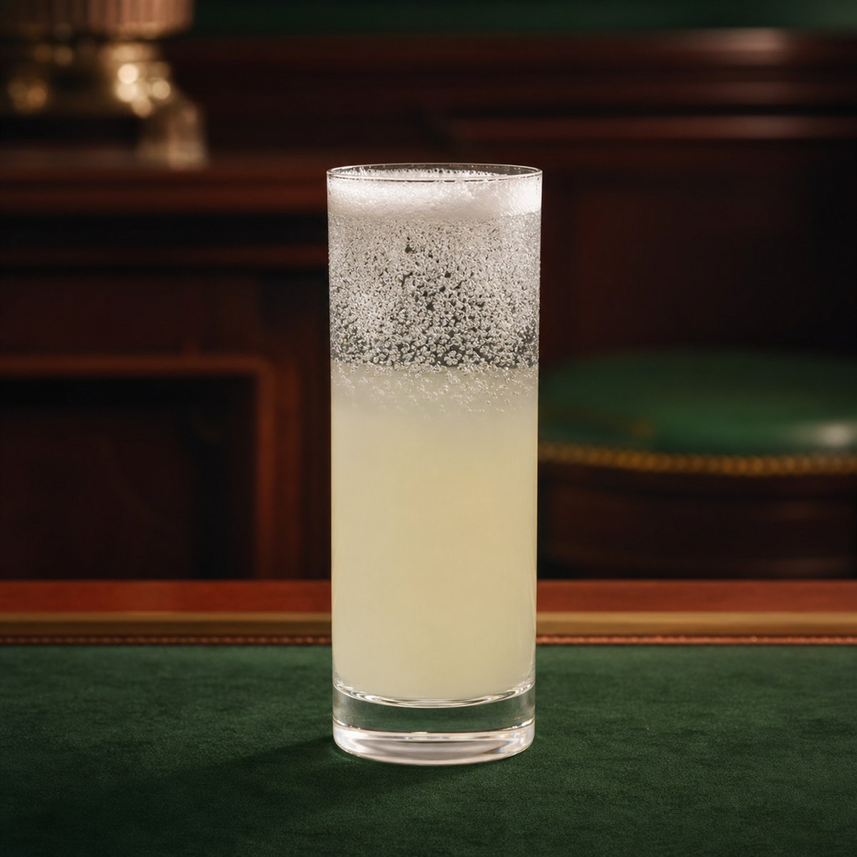 Gin Fizz cocktail served in a highball glass with none